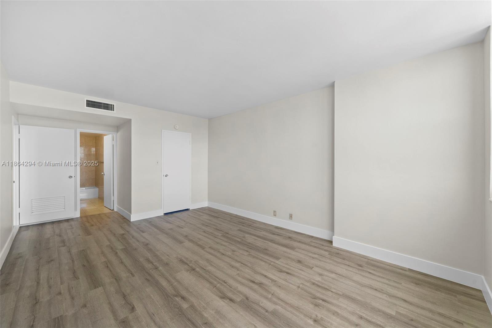 3301 Northeast 5th Avenue, Unit 1018 Miami, FL 33137 - Photo 5 of 24 a view of an empty room with wooden floor