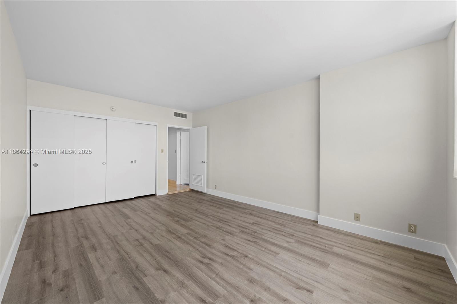 3301 Northeast 5th Avenue, Unit 1018 Miami, FL 33137 - Photo 9 of 24 a view of an empty room with wooden floor
