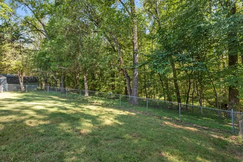 a backyard of a house with lots of green space