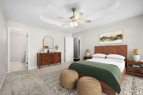 a bedroom with a bed and a dresser