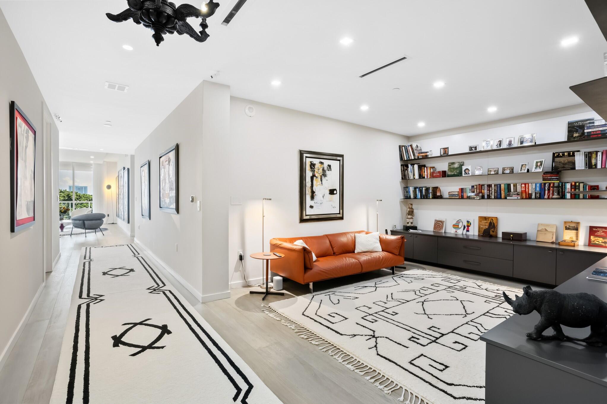 200 Southeast Mizner Boulevard, Unit 717 Boca Raton, FL 33432 - Photo 15 of 66 a living room with furniture and wooden floor