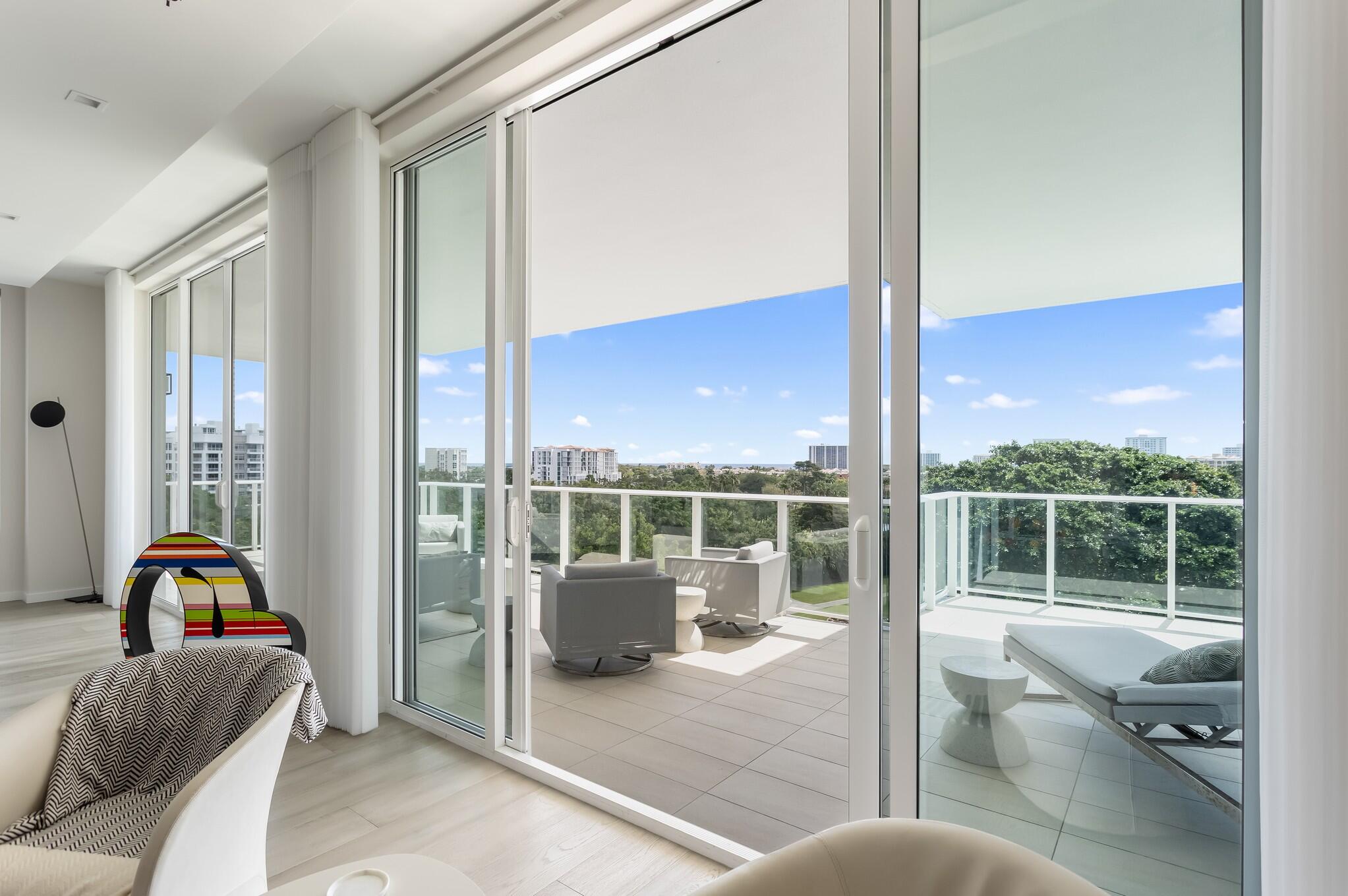 200 Southeast Mizner Boulevard, Unit 717 Boca Raton, FL 33432 - Photo 17 of 66 a living room filled with furniture