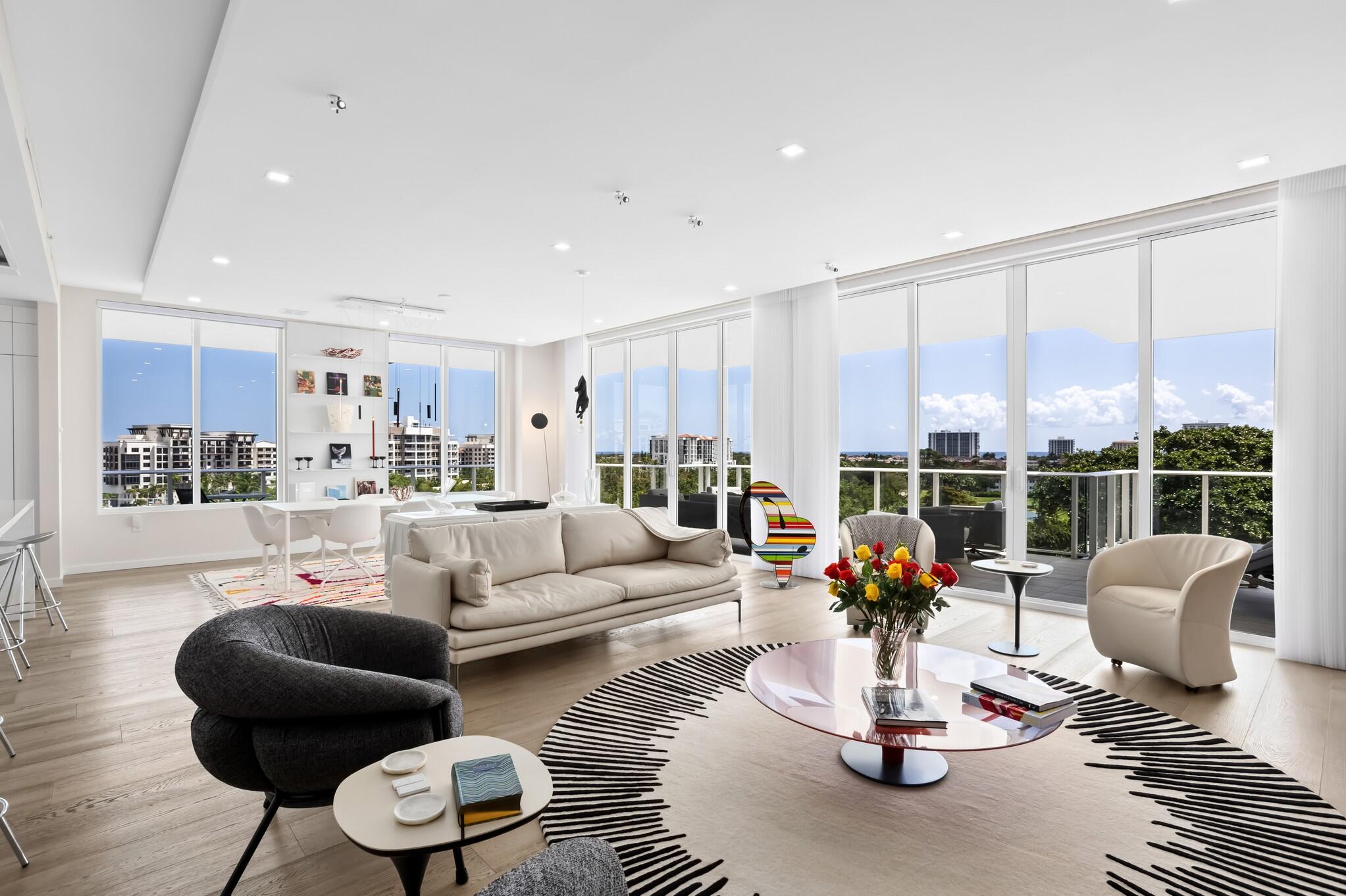 200 Southeast Mizner Boulevard, Unit 717 Boca Raton, FL 33432 - Photo 18 of 66 a living room with furniture and a large window