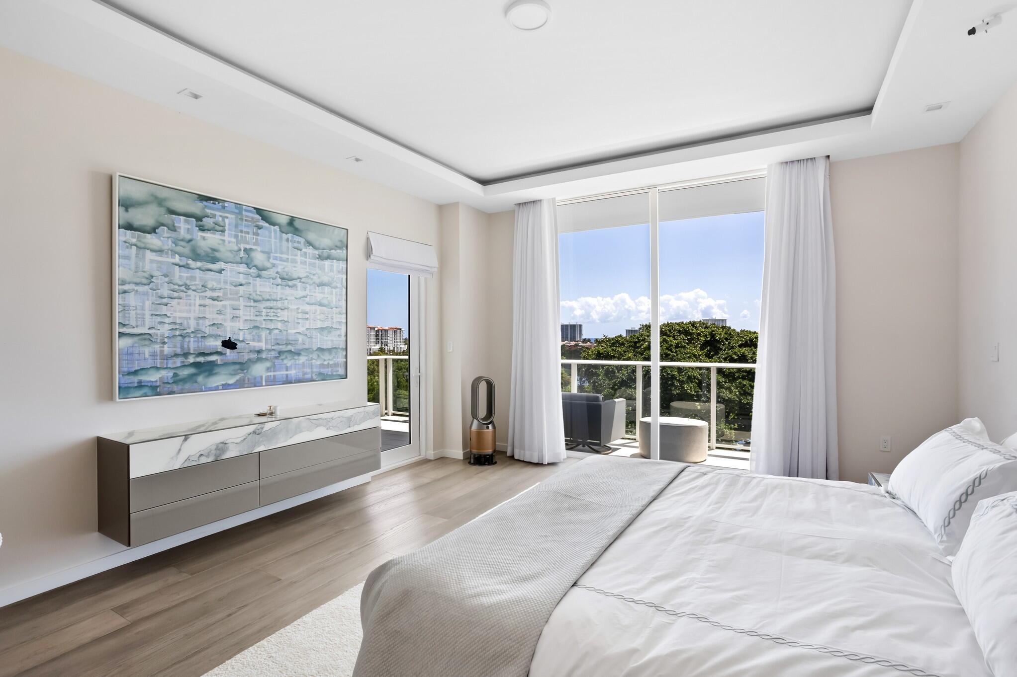 200 Southeast Mizner Boulevard, Unit 717 Boca Raton, FL 33432 - Photo 24 of 66 a bedroom with a large bed and a large window