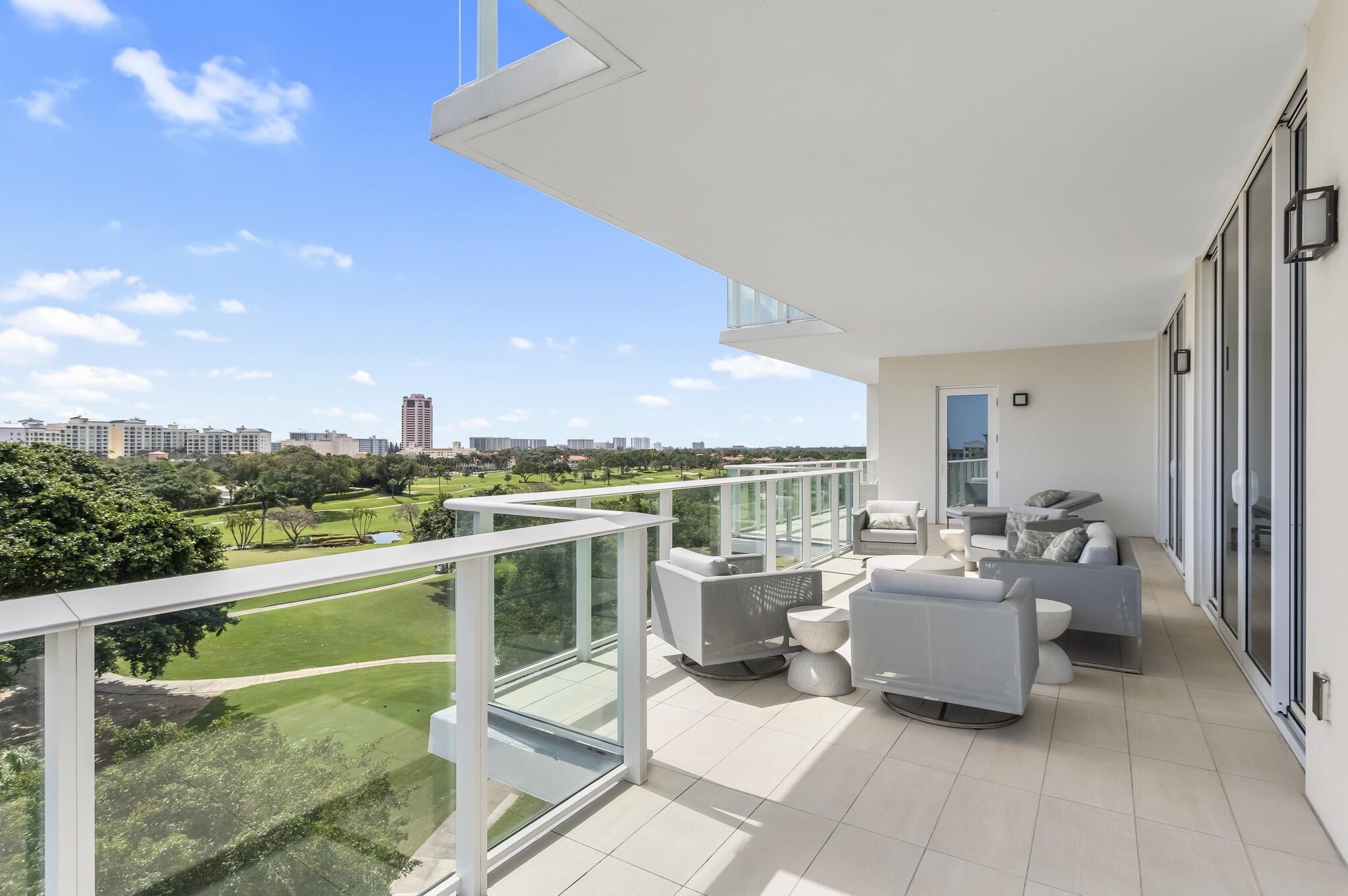 200 Southeast Mizner Boulevard, Unit 717 Boca Raton, FL 33432 - Photo 33 of 66 a view of a terrace with furniture and garden