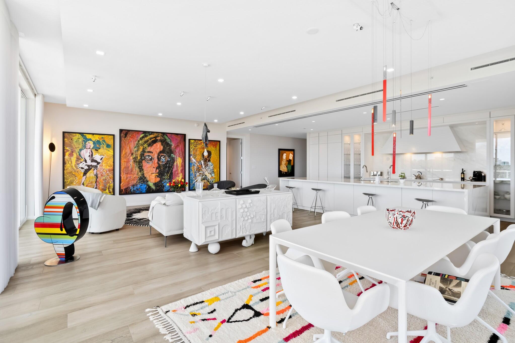 200 Southeast Mizner Boulevard, Unit 717 Boca Raton, FL 33432 - Photo 4 of 66 a living room with furniture and wooden floor