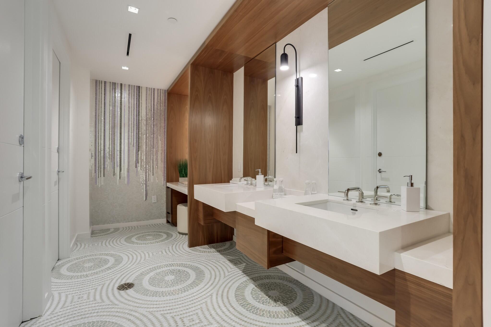 200 Southeast Mizner Boulevard, Unit 717 Boca Raton, FL 33432 - Photo 53 of 66 a bathroom with a sink a toilet and shower