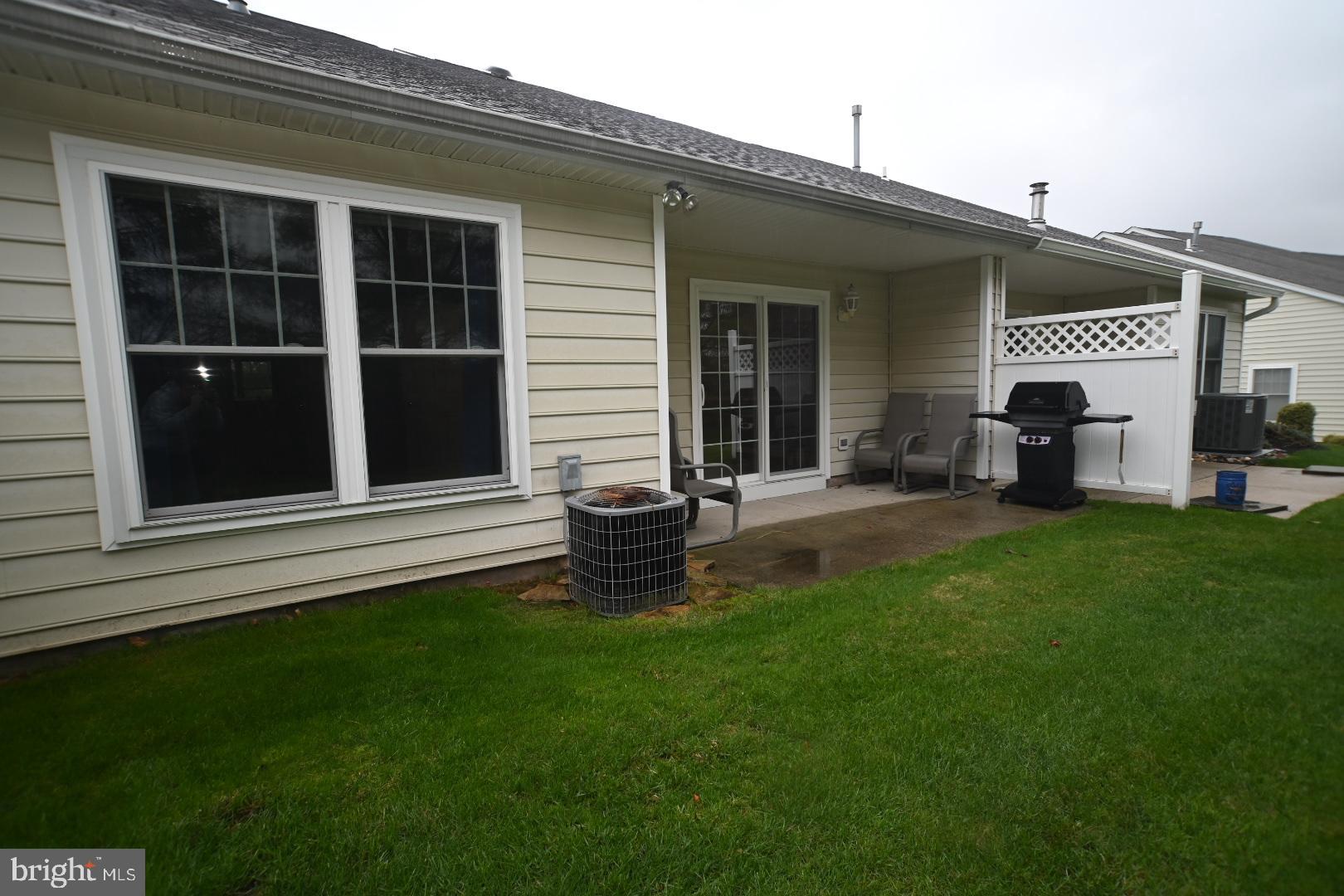 29 Ashley Drive Warminster, PA 18974 - Photo 14 of 44 a backyard of a house with table and chairs
