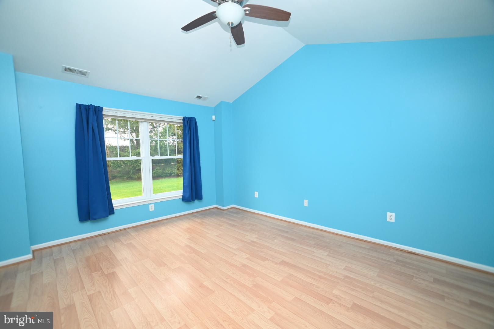 29 Ashley Drive Warminster, PA 18974 - Photo 16 of 44 a view of an empty room with a window and wooden floor