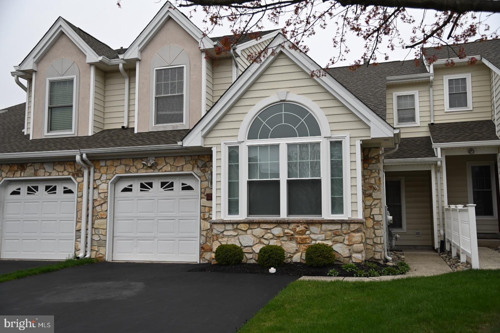 29 Ashley Drive Warminster, PA 18974 - Photo 2 of 44 a front view of a house with a garden and plants