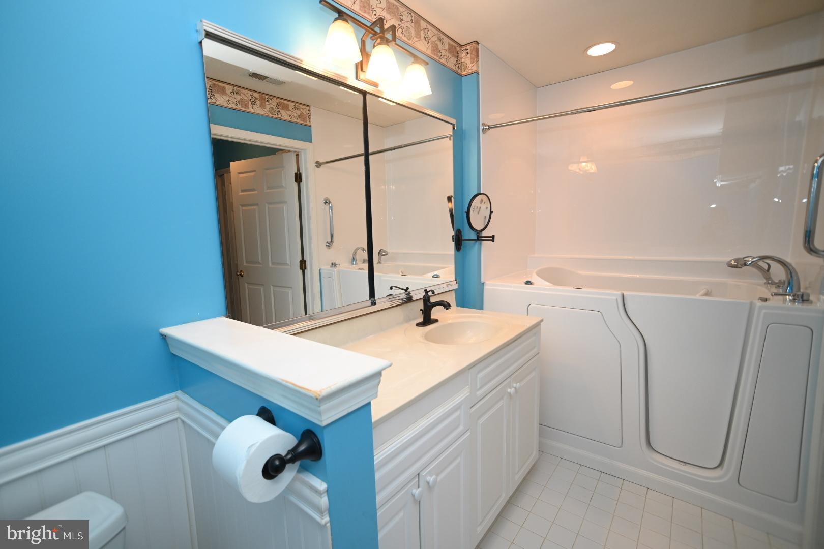 29 Ashley Drive Warminster, PA 18974 - Photo 21 of 44 a bathroom with a sink a vanity and a mirror