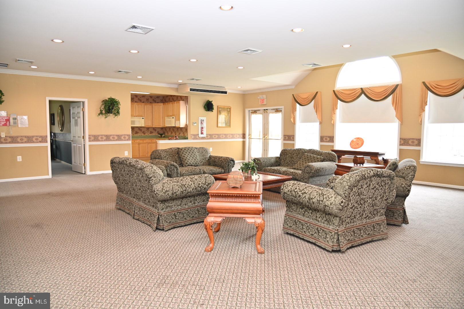 29 Ashley Drive Warminster, PA 18974 - Photo 39 of 44 a living room with furniture kitchen and a chandelier