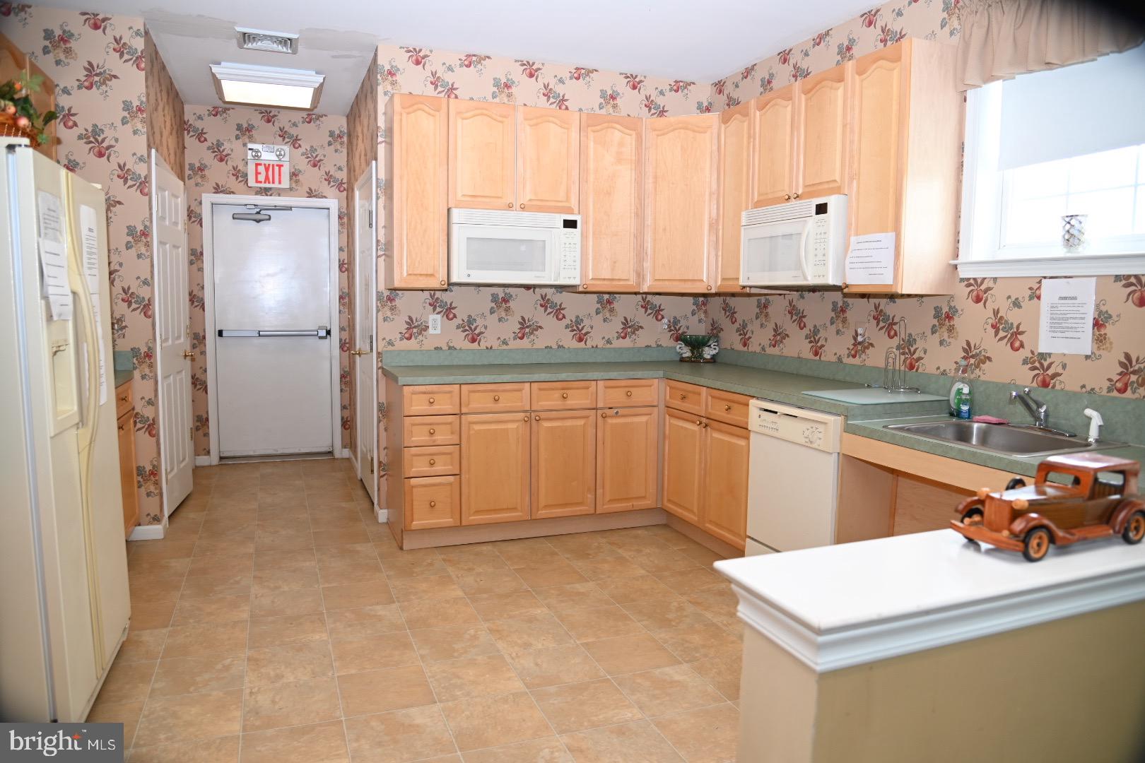 29 Ashley Drive Warminster, PA 18974 - Photo 42 of 44 a kitchen with a sink refrigerator and cabinets