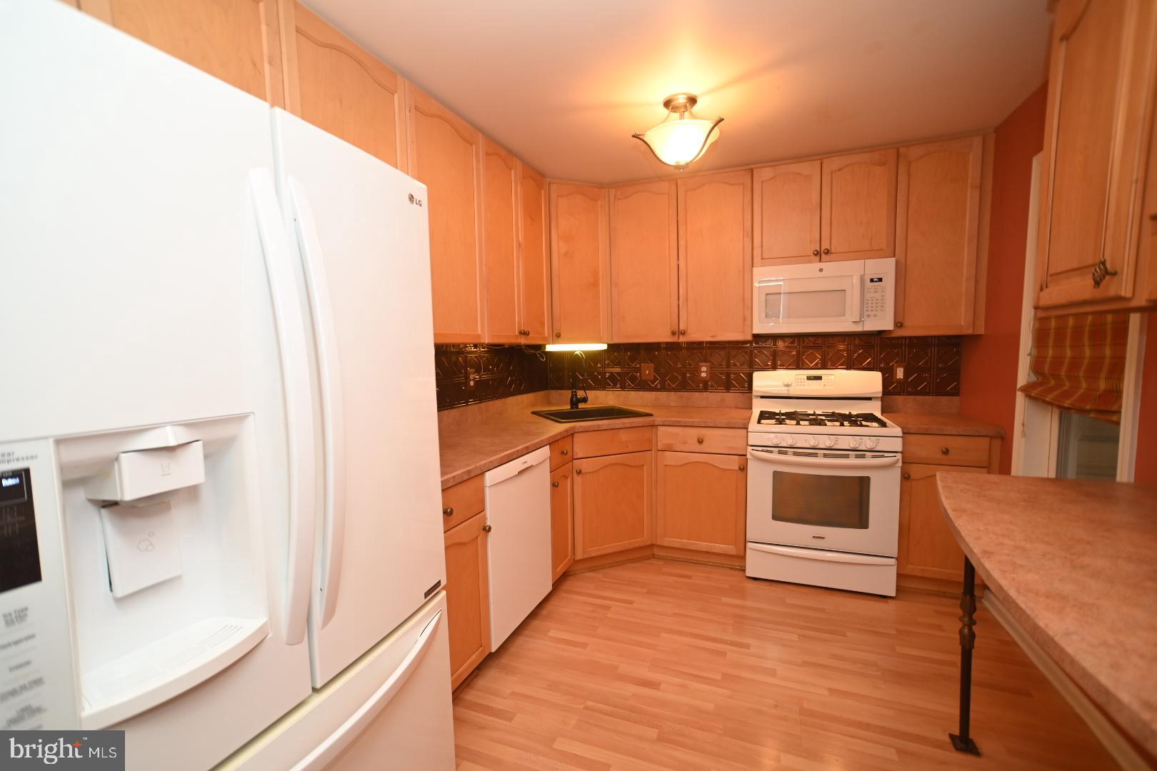 29 Ashley Drive Warminster, PA 18974 - Photo 8 of 44 a kitchen with a white stove top oven and sink