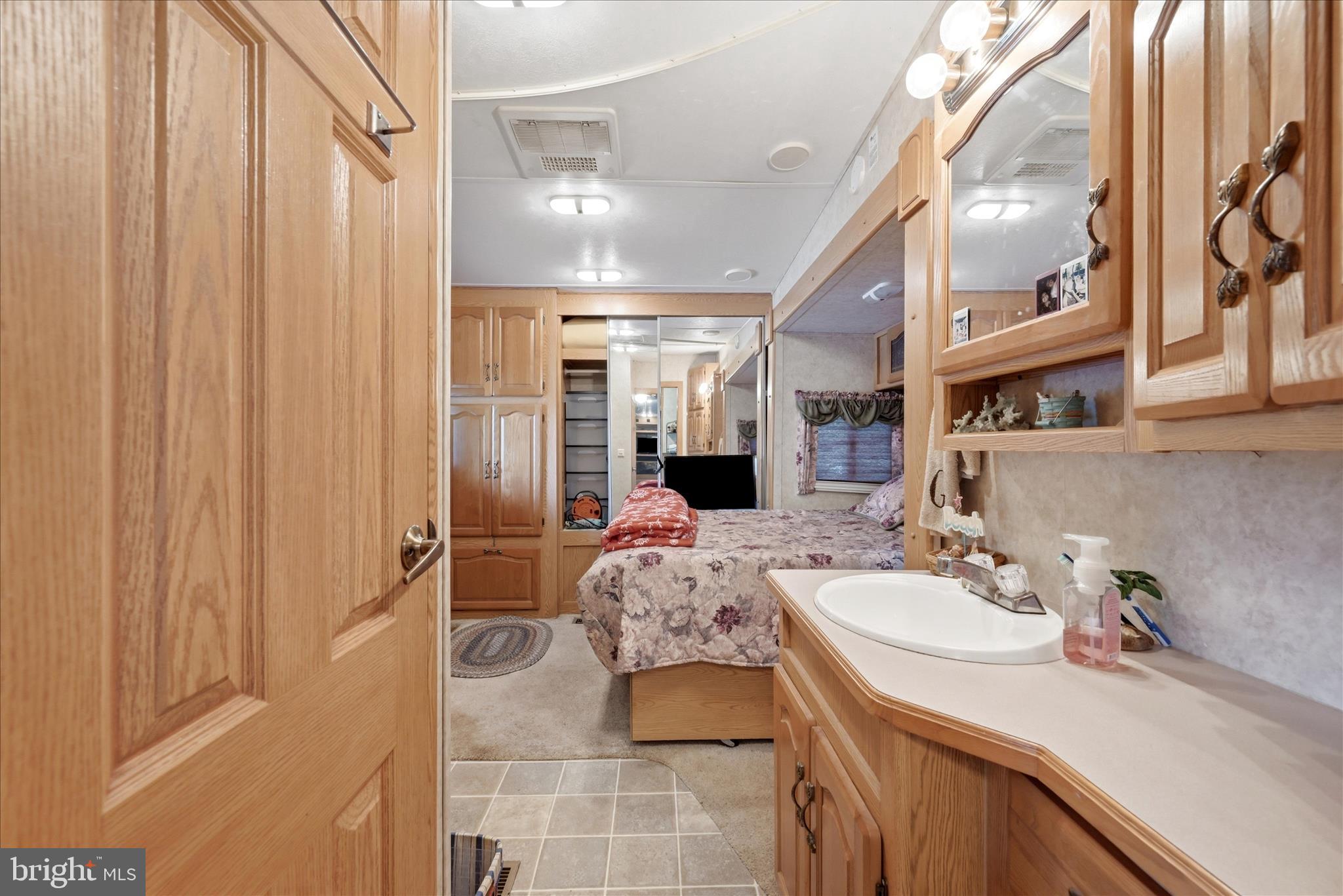 Lot 20 Hot Dog Road Falling Waters, WV 25419 - Photo 10 of 26 a bathroom with a sink double vanity and a mirror