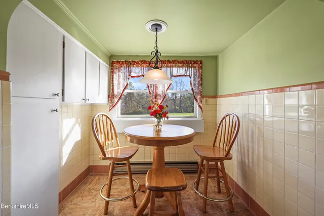 a view of a dining room with furniture window and outside view