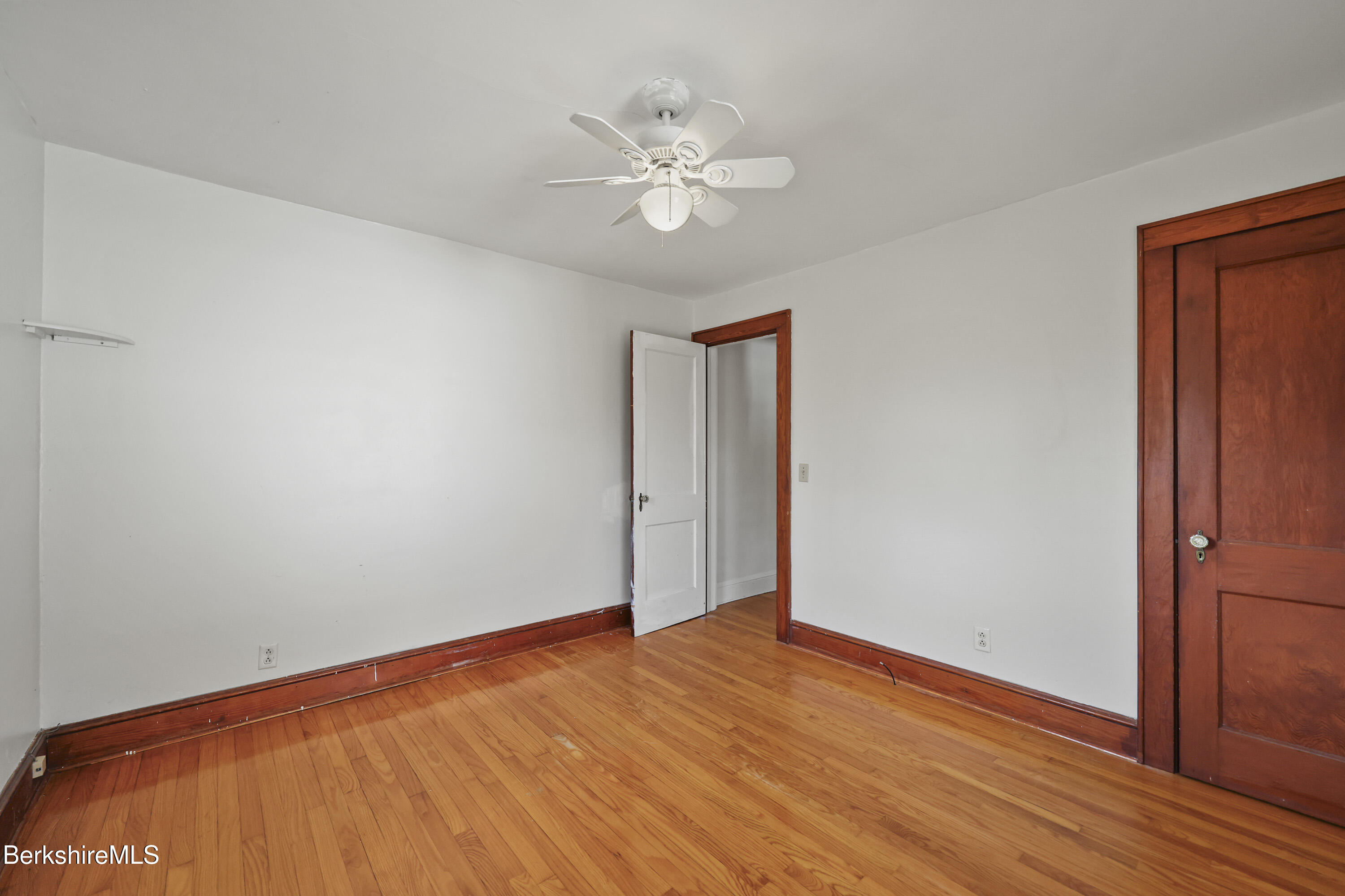 56 Tower Road Dalton, MA 01226 - Photo 13 of 24 a view of a room with wooden floor and a ceiling fan