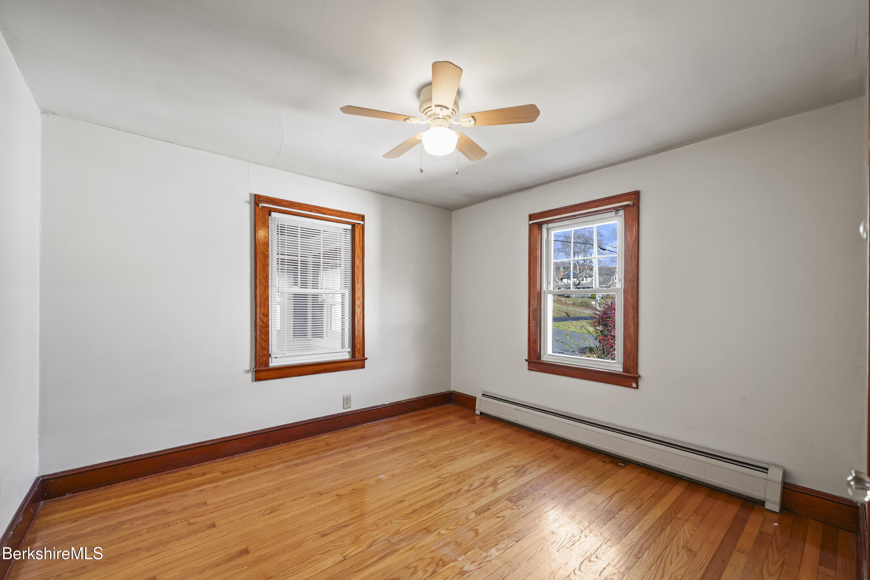 56 Tower Road Dalton, MA 01226 - Photo 14 of 24 a view of an empty room with wooden floor and a window