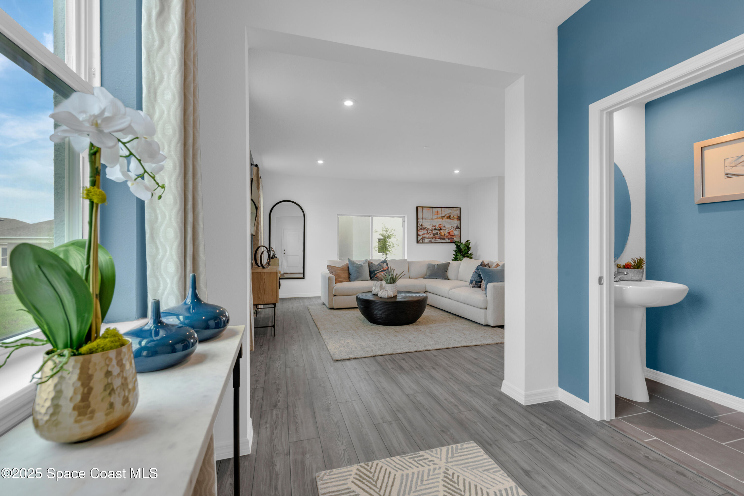 615 Poller Way Cocoa, FL 32927 - Photo 12 of 29 a living room with furniture fireplace and wooden floor