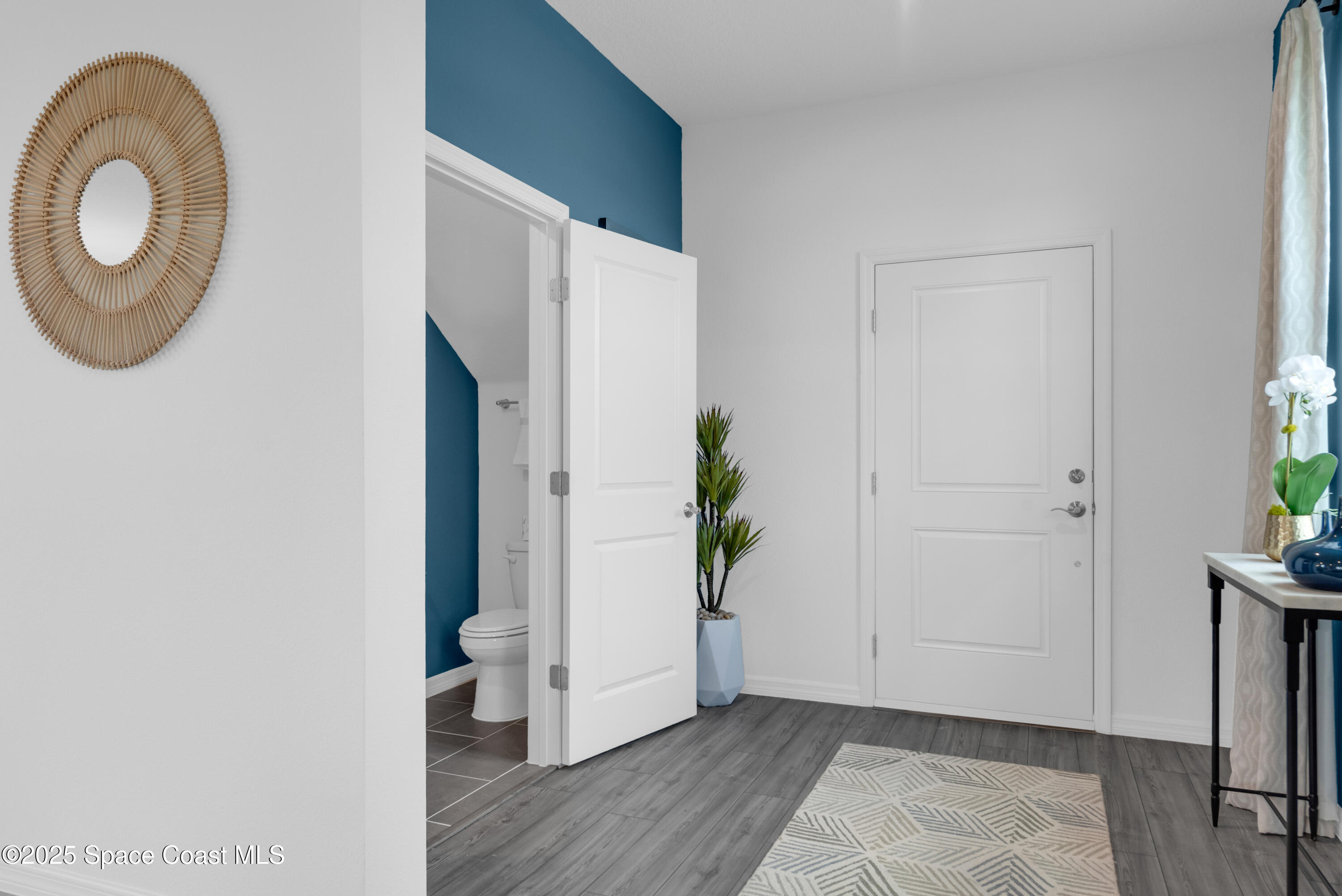 615 Poller Way Cocoa, FL 32927 - Photo 14 of 29 a view of a room that has wooden floor and a potted plant