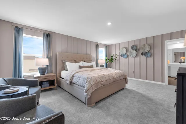 a bedroom with a bed and a couch