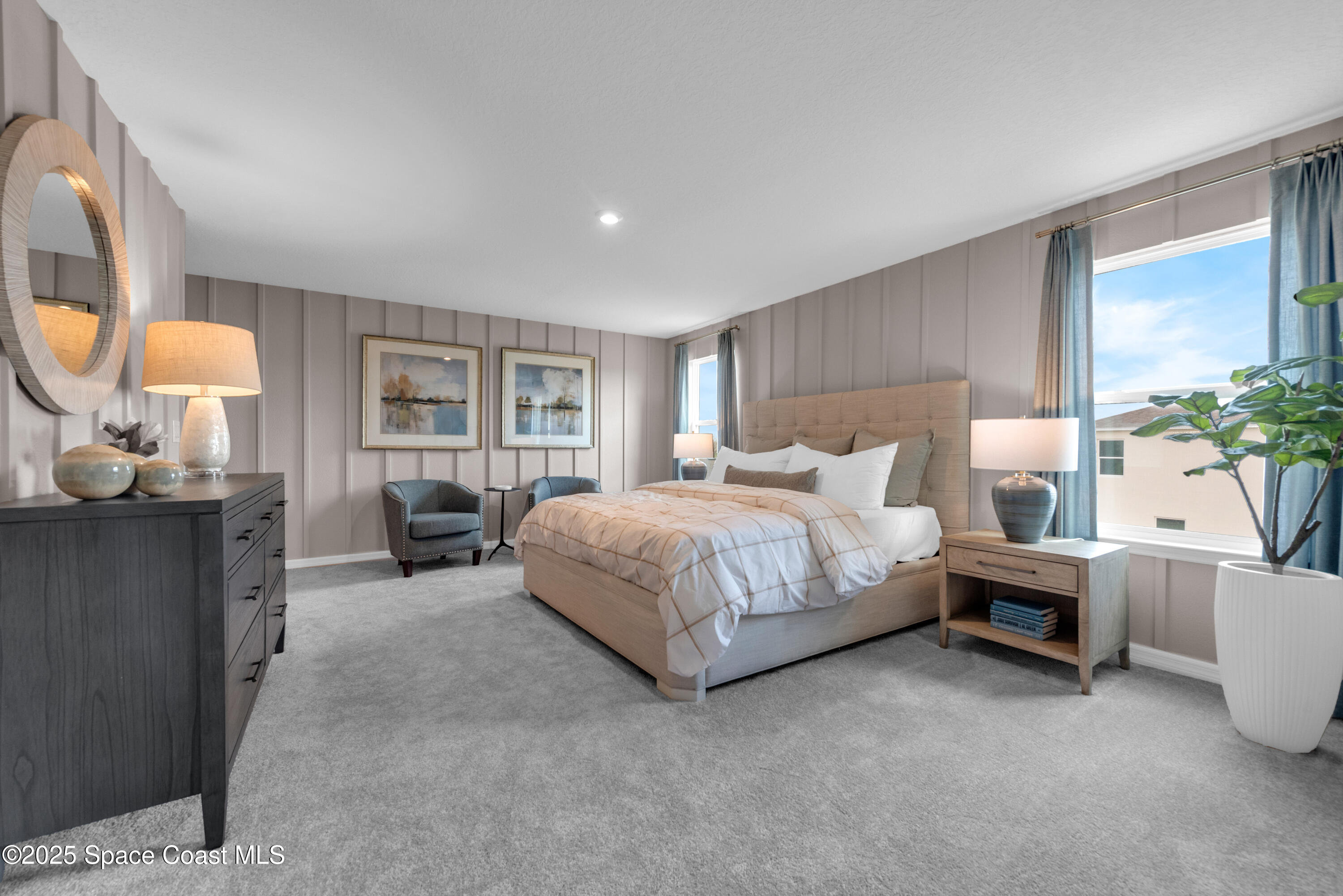 615 Poller Way Cocoa, FL 32927 - Photo 18 of 29 a spacious bedroom with a bed a mirror and a large window