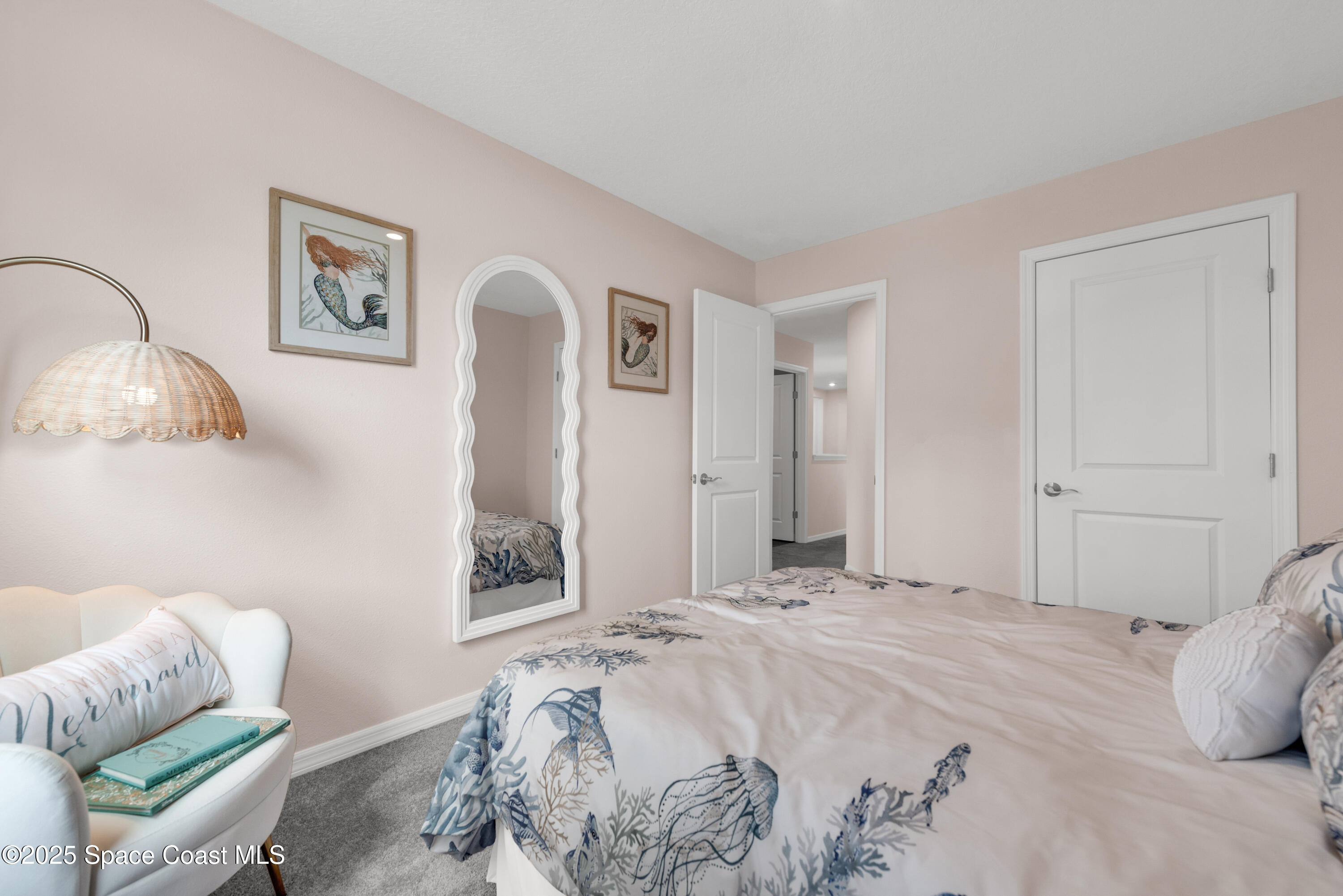 615 Poller Way Cocoa, FL 32927 - Photo 20 of 29 a bedroom with a bed and a couch