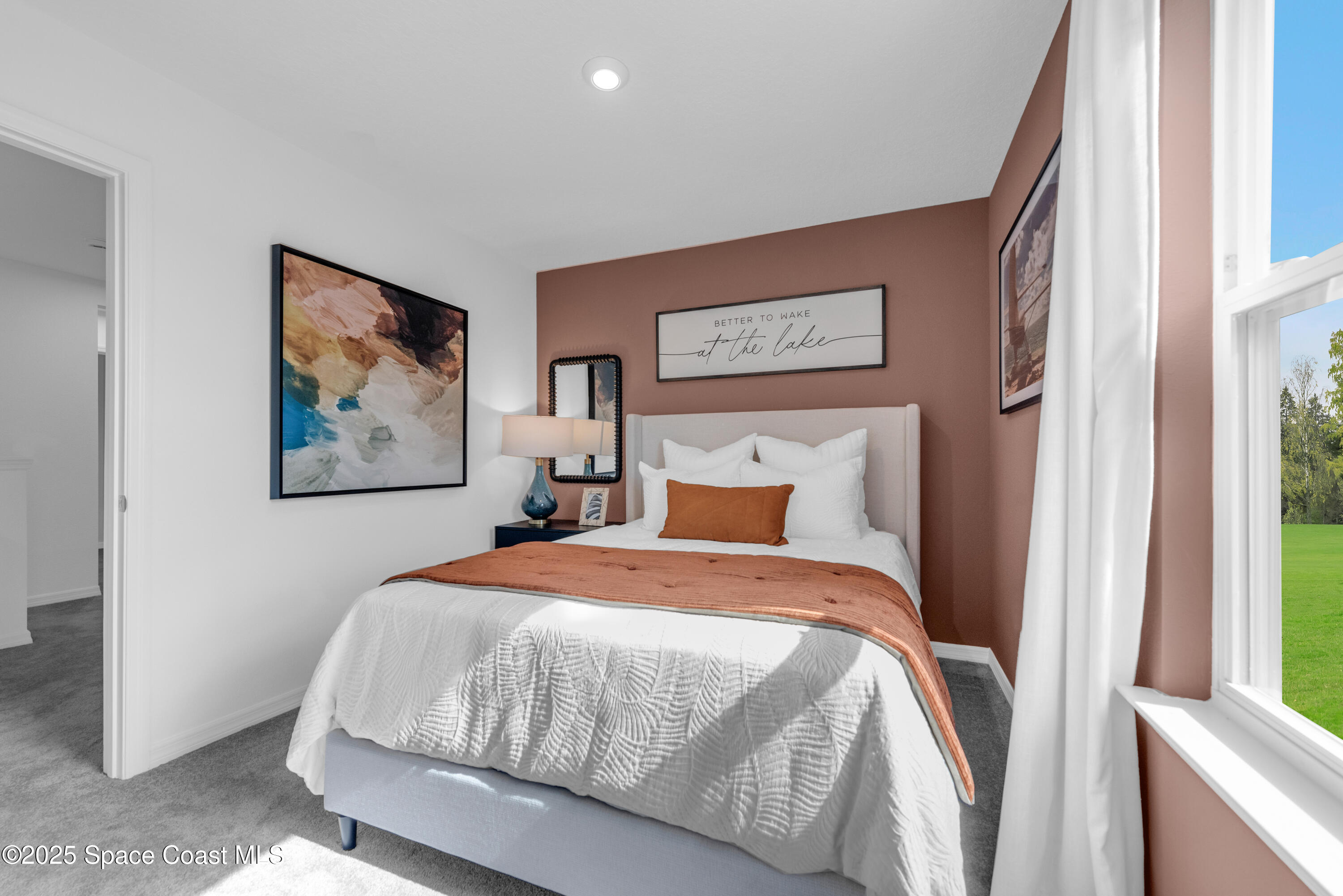 615 Poller Way Cocoa, FL 32927 - Photo 26 of 29 a bedroom with a bed and a painting on the wall