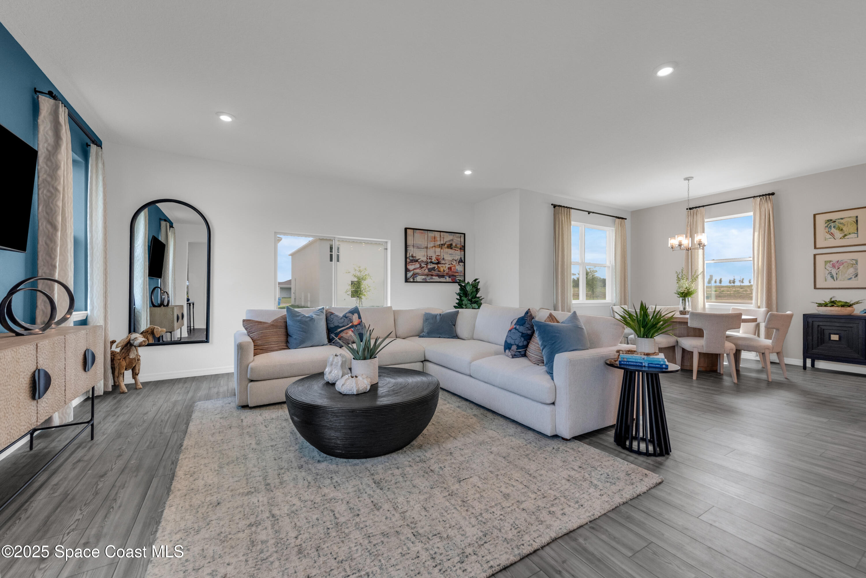 615 Poller Way Cocoa, FL 32927 - Photo 3 of 29 a living room with furniture and wooden floor