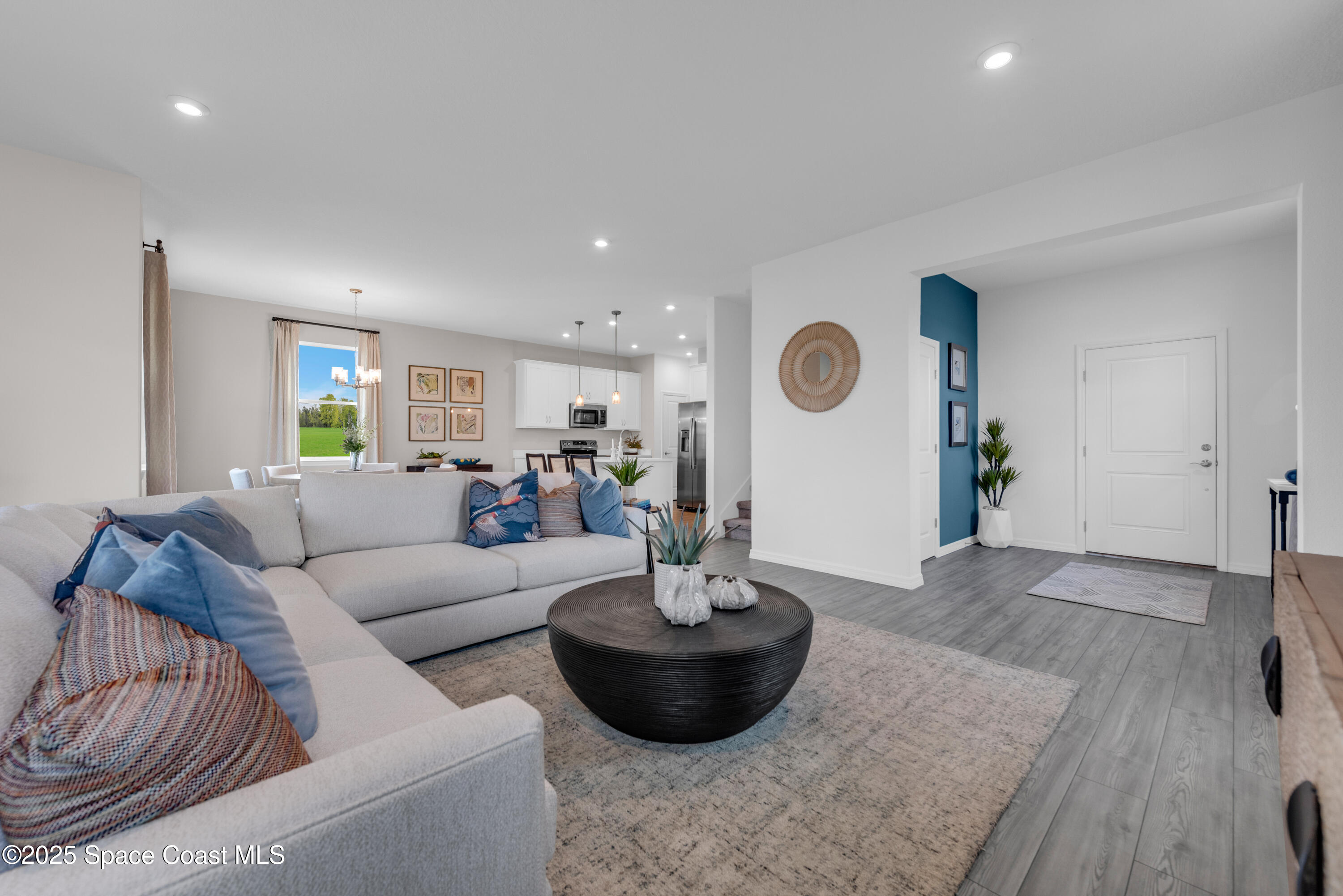 615 Poller Way Cocoa, FL 32927 - Photo 4 of 29 a living room with furniture and wooden floor