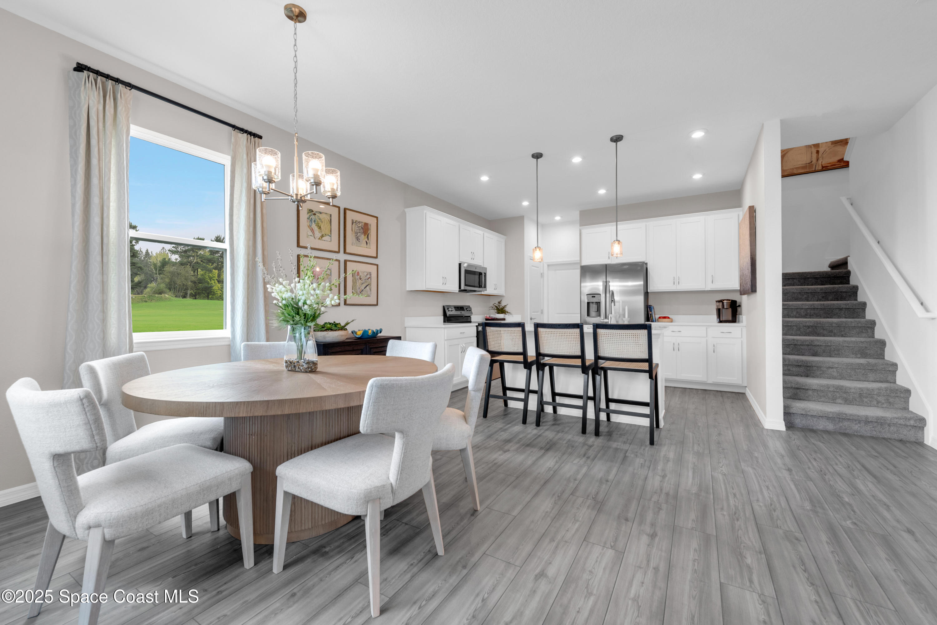 615 Poller Way Cocoa, FL 32927 - Photo 5 of 29 a dining room with furniture and wooden floor