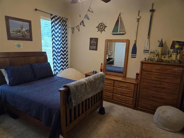 a bedroom with furniture and wooden floor