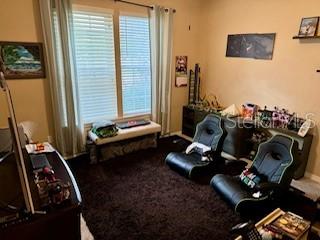 7971 Southwest 80th Lane Gainesville, FL 32608 - Photo 20 of 22 a bedroom with furniture and a window