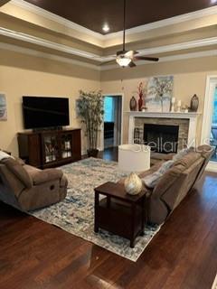 7971 Southwest 80th Lane Gainesville, FL 32608 - Photo 2 of 22 a living room with furniture a flat screen tv and a fireplace
