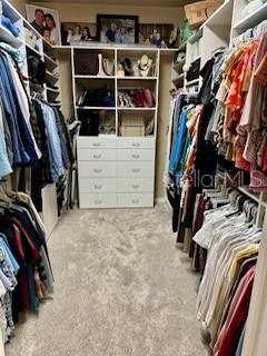 7971 Southwest 80th Lane Gainesville, FL 32608 - Photo 9 of 22 a view of walk in closet with clothes and shoes