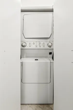 a close up view of a utility room with washer and dryer