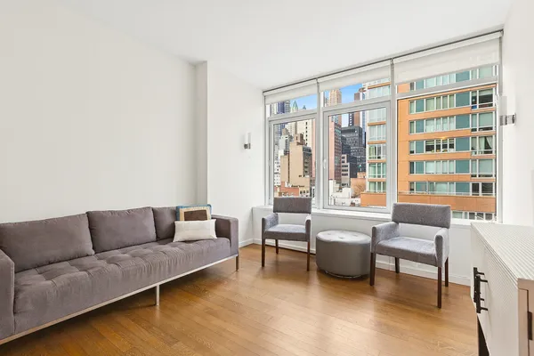 a living room with furniture and a large window