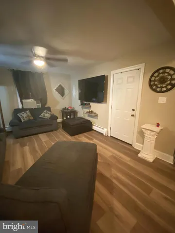 a white kitchen with a stove top oven