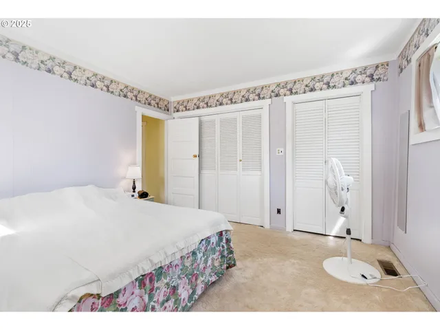 a bathroom with a sink vanity granite tub shower and a mirror