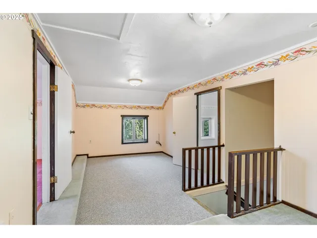 a view of a hallway with wooden shelves