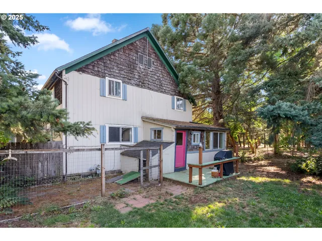 a view of house with backyard