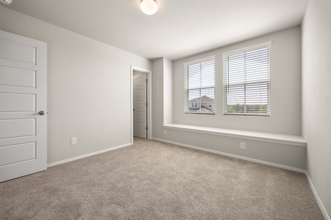 158 Linnet Lane Maxwell, TX 78656 - Photo 10 of 17 an empty room with windows