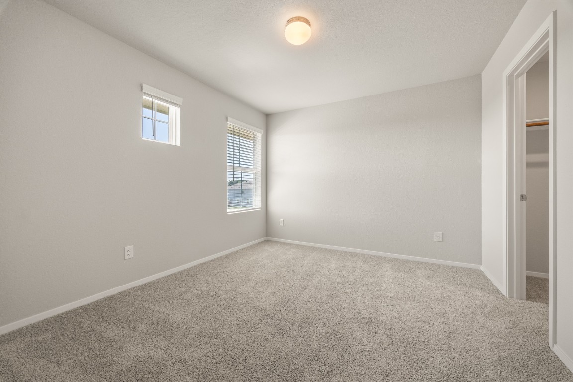 158 Linnet Lane Maxwell, TX 78656 - Photo 11 of 17 an empty room with windows