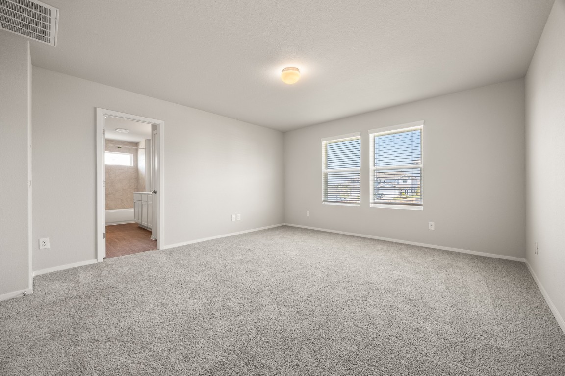 158 Linnet Lane Maxwell, TX 78656 - Photo 13 of 17 an empty room with windows and closet
