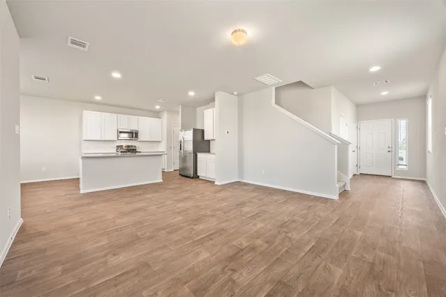 a view of a kitchen with a sink and an oven