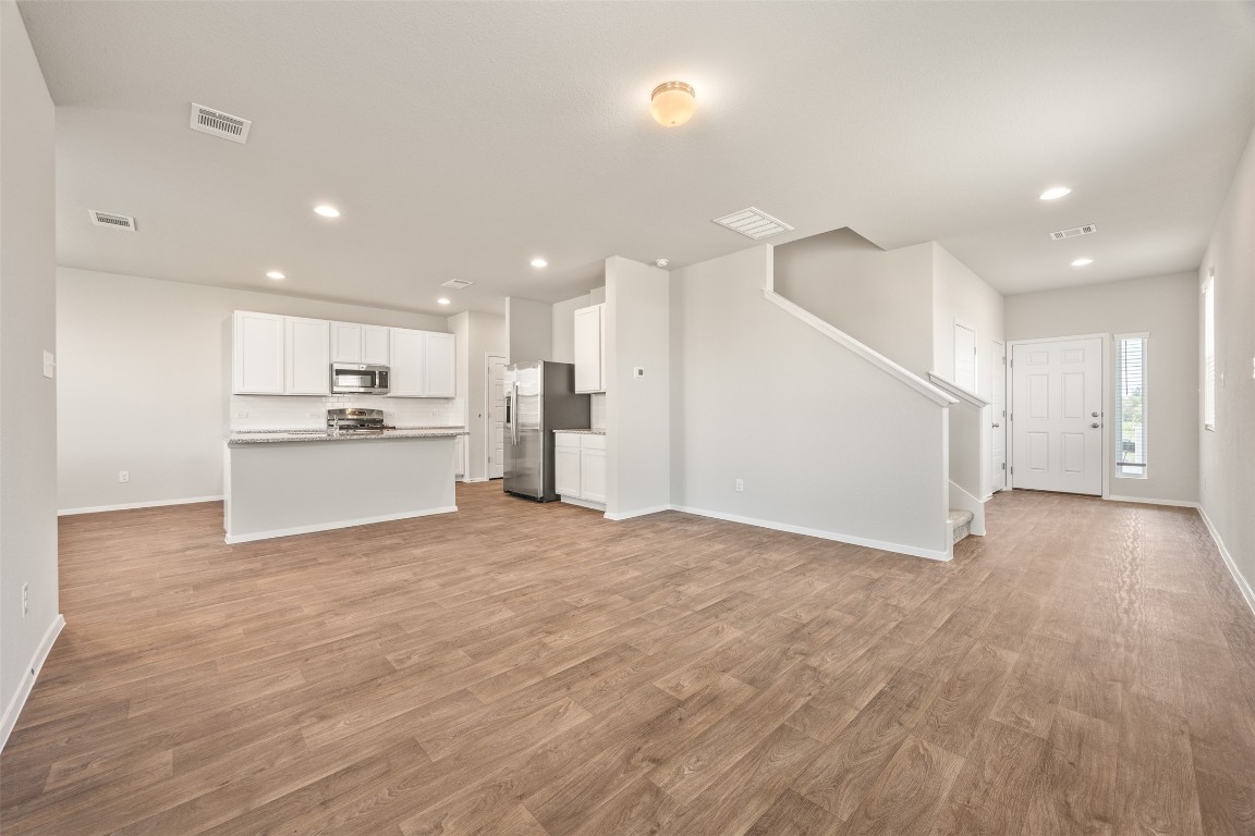 158 Linnet Lane Maxwell, TX 78656 - Photo 3 of 17 a view of a kitchen with a sink and an oven