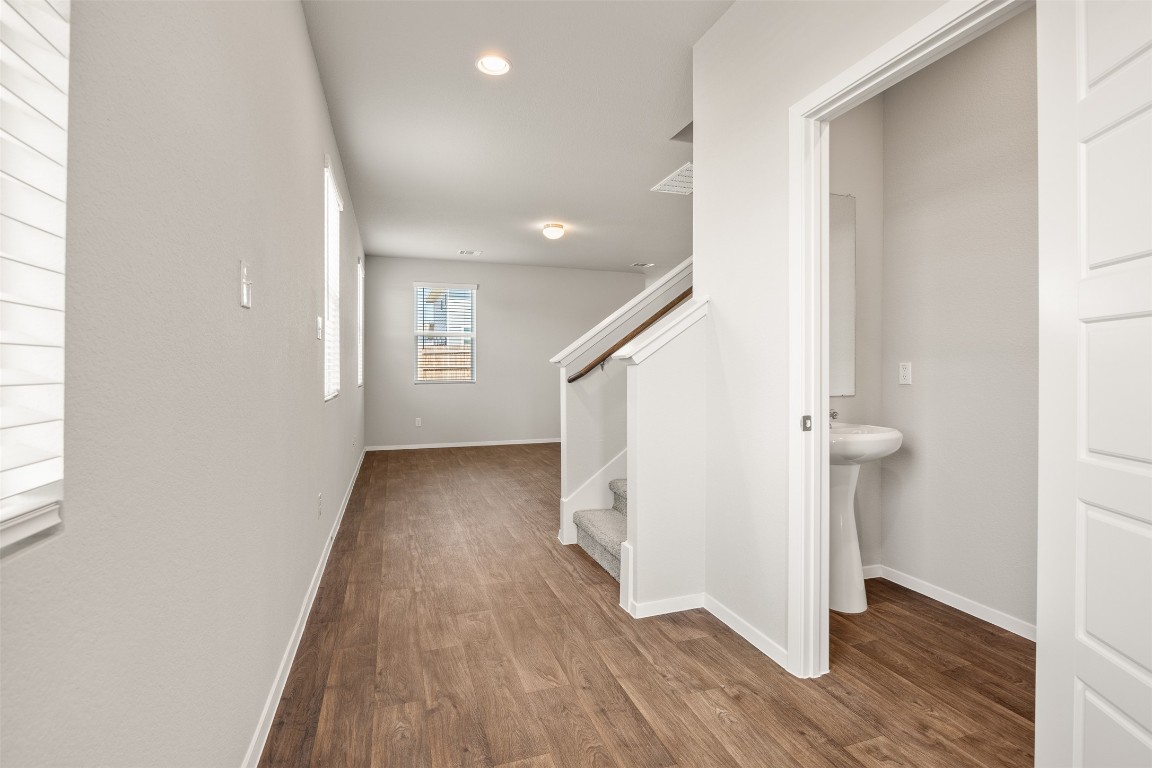 158 Linnet Lane Maxwell, TX 78656 - Photo 4 of 17 a view of hallway with wooden floor