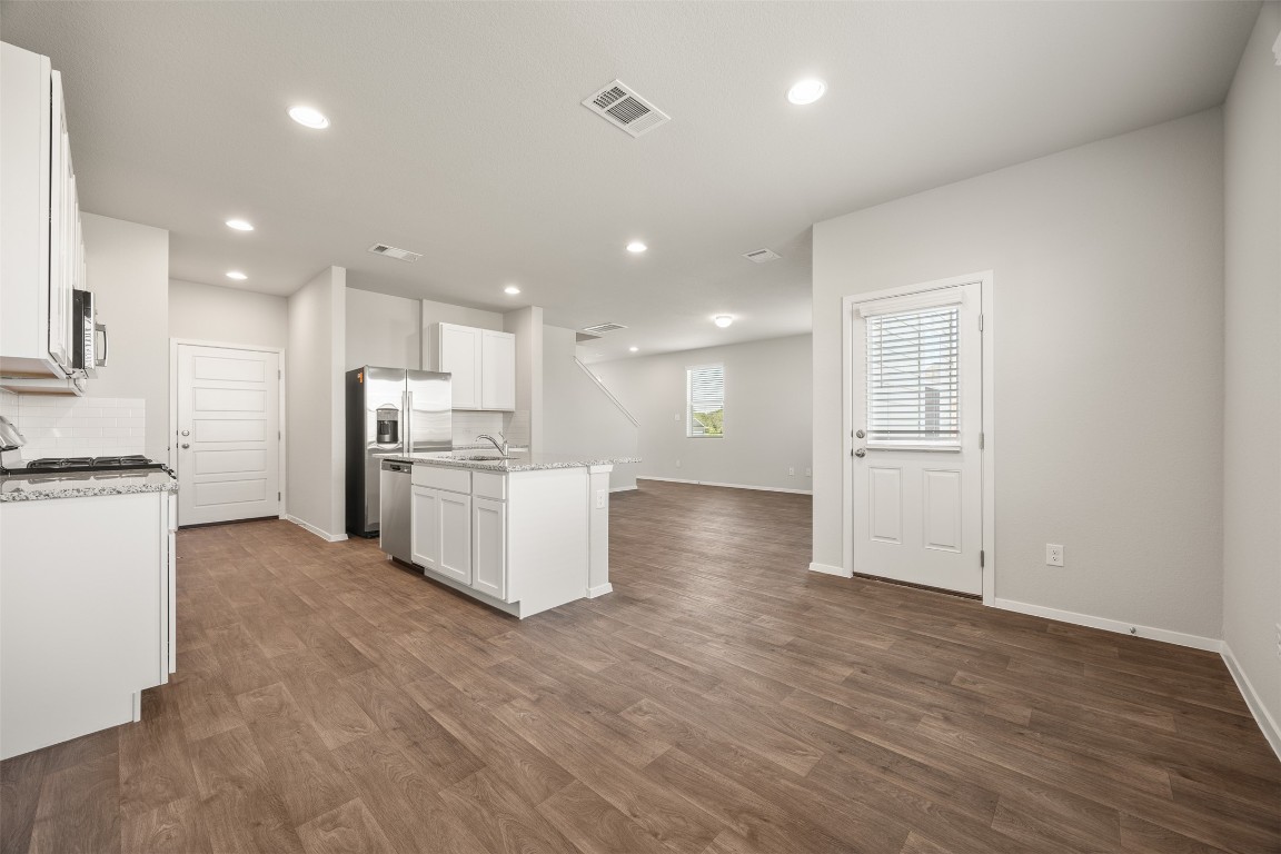 158 Linnet Lane Maxwell, TX 78656 - Photo 17 of 17 a view of kitchen with wooden floor and electronic appliances