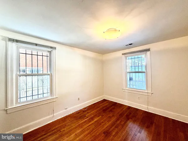 a view of front door with wooden floor