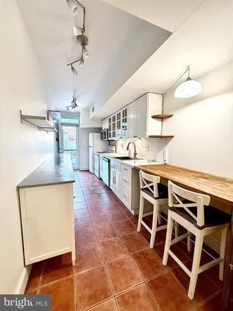 a kitchen with a sink and a stove
